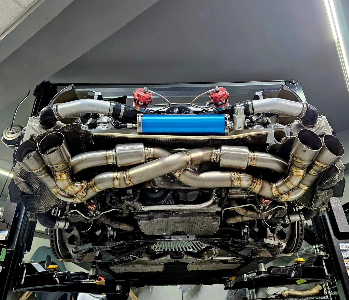 Performance exhaust mounted under a vehicle